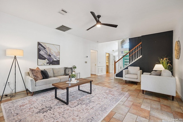 1159 Bluff Frst, San Antonio, TX 78248 - living room featuring stairs, ceiling fan, and stone tile floors