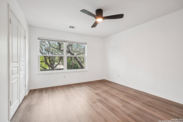 1159 Bluff Frst, San Antonio, TX 78248 - unfurnished bedroom with wood finished floors, a closet, and ceiling fan