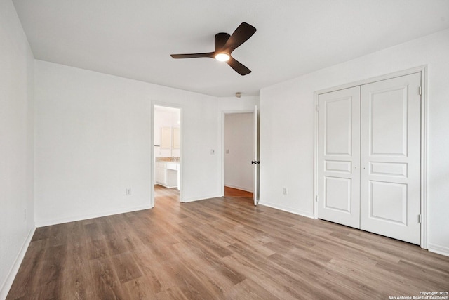 1159 Bluff Frst, San Antonio, TX 78248 - unfurnished bedroom with light wood-style floors, a closet, ceiling fan, and ensuite bath