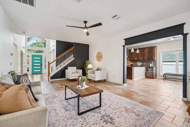 1159 Bluff Frst, San Antonio, TX 78248 - living room featuring a ceiling fan and stairway