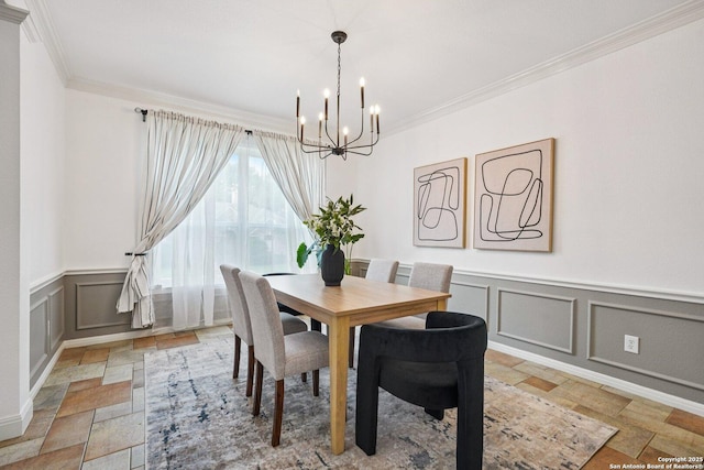 1159 Bluff Frst, San Antonio, TX 78248 - dining space featuring a chandelier, a decorative wall, crown molding, stone tile flooring, and wainscoting