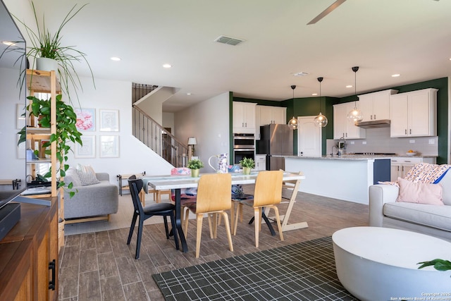 5944 Sterling Vw, Schertz, TX 78108 - dining space featuring stairway, recessed lighting, dark wood-type flooring, and ceiling fan