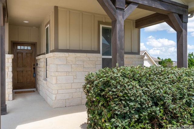 5944 Sterling Vw, Schertz, TX 78108 - doorway to property with board and batten siding and stone siding