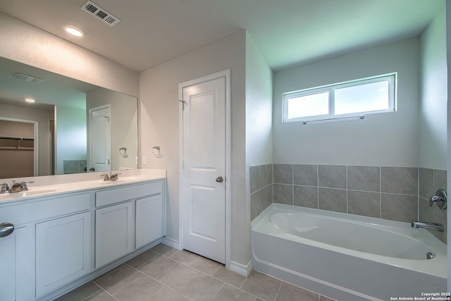 3008 Pemberton Post, San Antonio, TX 78245 - bathroom with a closet, a garden tub, tile patterned floors, and double vanity