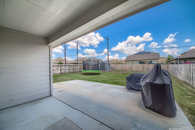 3008 Pemberton Post, San Antonio, TX 78245 - fenced backyard featuring a trampoline, a patio, and a storage shed