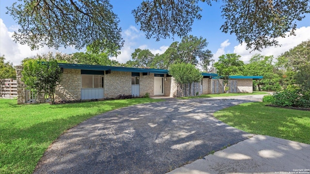 1318 Mount Vieja, San Antonio, TX 78213 - view of front of property featuring driveway, a front lawn, and brick siding