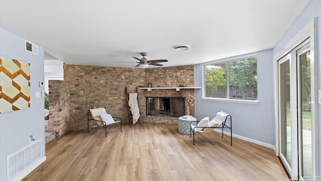 1318 Mount Vieja, San Antonio, TX 78213 - living area featuring wood finished floors, ceiling fan, and a fireplace