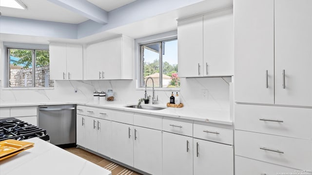 1318 Mount Vieja, San Antonio, TX 78213 - kitchen featuring stainless steel dishwasher, decorative backsplash, white cabinets, light stone countertops, and beamed ceiling