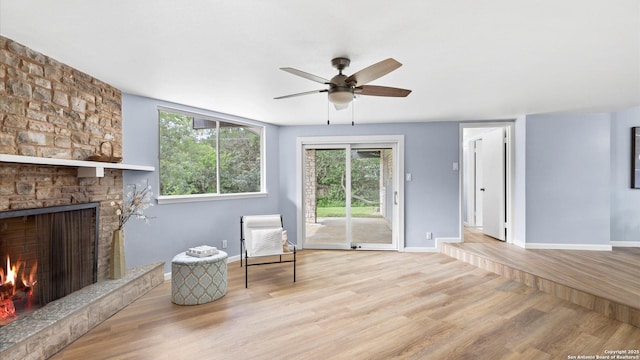 1318 Mount Vieja, San Antonio, TX 78213 - living area featuring wood finished floors, ceiling fan, and a large fireplace