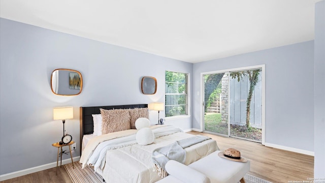1318 Mount Vieja, San Antonio, TX 78213 - bedroom featuring access to outside and wood finished floors