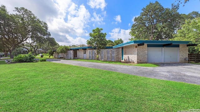 1318 Mount Vieja, San Antonio, TX 78213 - view of front of home featuring driveway, stone siding, and an attached garage