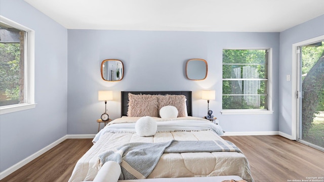 1318 Mount Vieja, San Antonio, TX 78213 - bedroom with access to exterior and wood finished floors