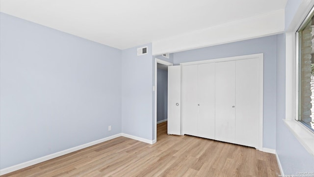 1318 Mount Vieja, San Antonio, TX 78213 - unfurnished bedroom featuring wood finished floors and a closet