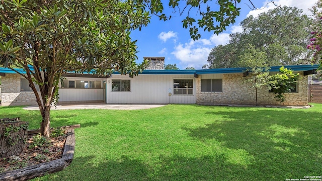 1318 Mount Vieja, San Antonio, TX 78213 - view of front of house featuring a patio, stone siding, a front lawn, and a chimney
