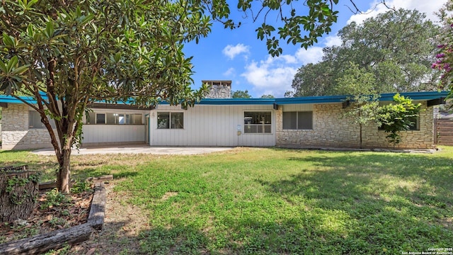 1318 Mount Vieja, San Antonio, TX 78213 - view of front facade with a patio, a front lawn, stone siding, and a chimney
