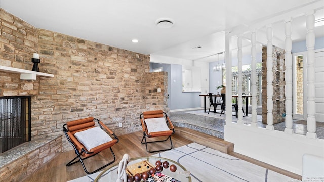 1318 Mount Vieja, San Antonio, TX 78213 - living area featuring wood finished floors, a fireplace, and a chandelier