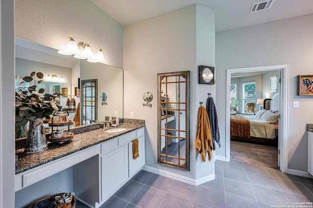 13942 Evelina, San Antonio, TX 78253 - full bathroom featuring ensuite bath, tile patterned floors, vanity, and vaulted ceiling