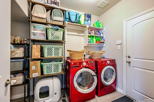13942 Evelina, San Antonio, TX 78253 - washroom featuring washing machine and clothes dryer, tile patterned flooring, and a textured ceiling