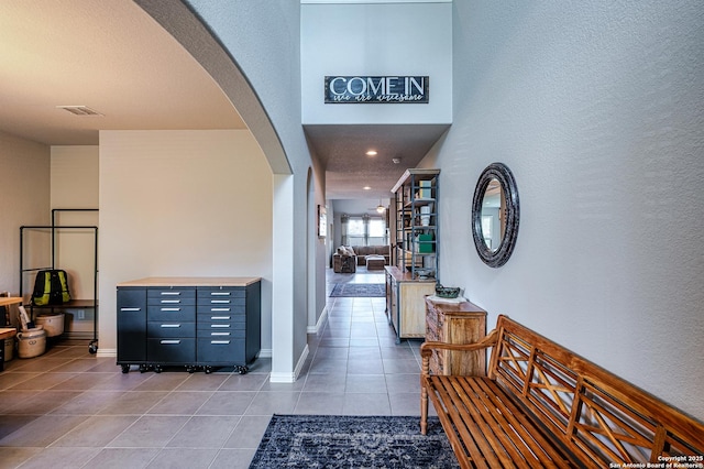 13942 Evelina, San Antonio, TX 78253 - hallway with arched walkways and light tile patterned floors
