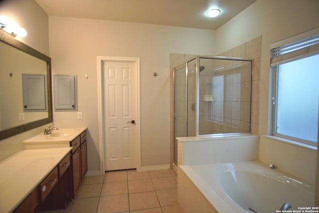 24123 Horse Pr, San Antonio, TX 78261 - bathroom with vanity, a garden tub, a shower stall, and tile patterned flooring