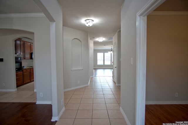 24123 Horse Pr, San Antonio, TX 78261 - hall with arched walkways, light tile patterned flooring, and ornamental molding