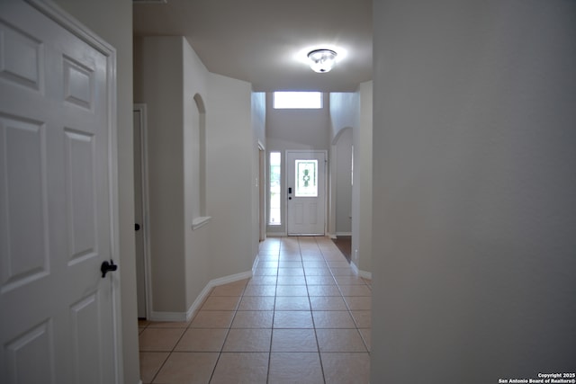 24123 Horse Pr, San Antonio, TX 78261 - hallway with light tile patterned floors and arched walkways