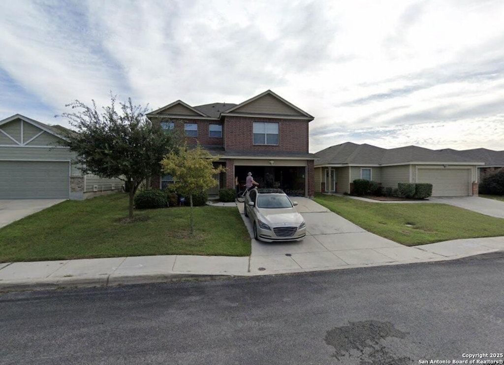 4522 Gambels Quail, Converse, TX 78109 - view of front of house featuring concrete driveway, a front yard, and brick siding