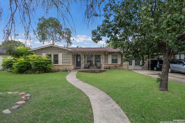 450 Pamela, San Antonio, TX 78223 - single story home featuring a front lawn, stone siding, and driveway