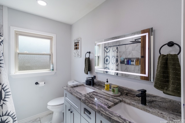 450 Pamela, San Antonio, TX 78223 - full bathroom with double vanity, marble look tiles, and a shower with shower curtain