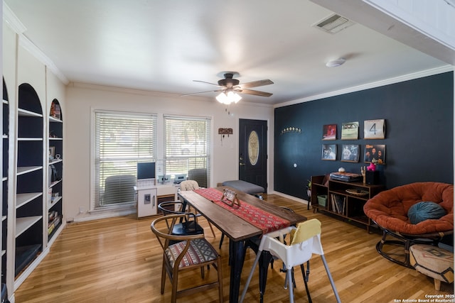 450 Pamela, San Antonio, TX 78223 - dining area featuring light wood-style flooring, crown molding, and ceiling fan
