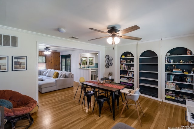 450 Pamela, San Antonio, TX 78223 - dining space featuring ornamental molding, a ceiling fan, wood finished floors, and built in features