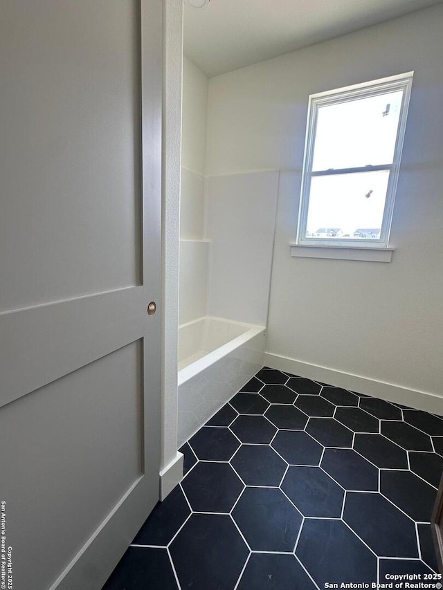 129 Merion Ln, Vernia, TX 78121 - bathroom with tile patterned floors and a bath