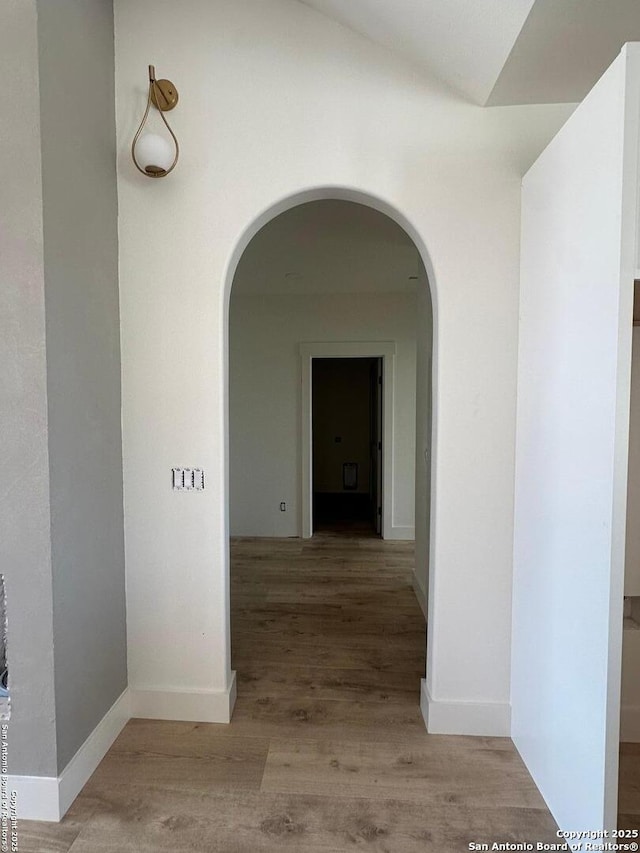 129 Merion Ln, Vernia, TX 78121 - hall featuring arched walkways and wood finished floors