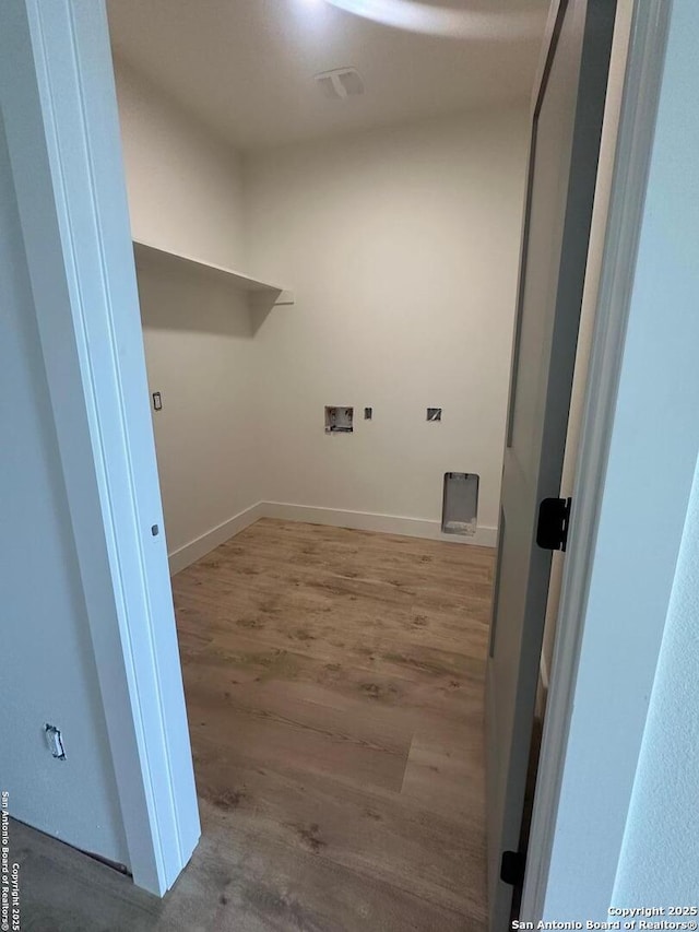 129 Merion Ln, Vernia, TX 78121 - laundry room featuring washer hookup and wood finished floors