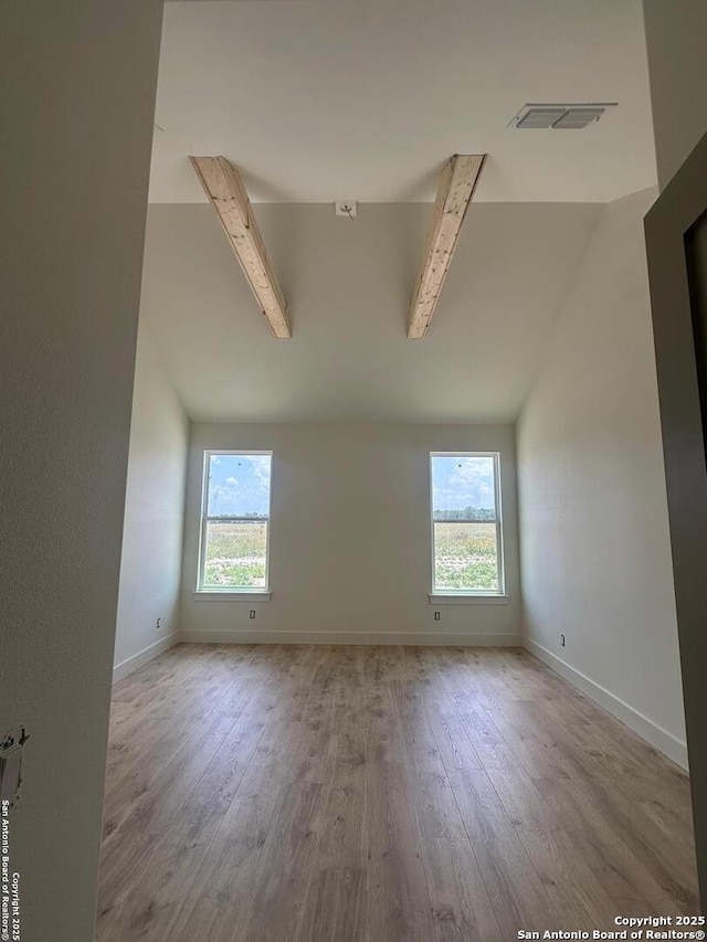 129 Merion Ln, Vernia, TX 78121 - spare room with hardwood / wood-style floors, lofted ceiling, and healthy amount of natural light