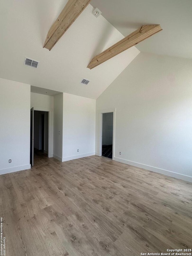 129 Merion Ln, Vernia, TX 78121 - empty room with beam ceiling, light wood-style flooring, and high vaulted ceiling