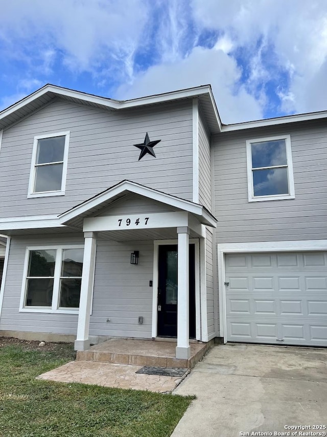 7947 Ruby Mdws, San Antonio, TX 78251 - view of front of home featuring a garage, covered porch, and concrete driveway