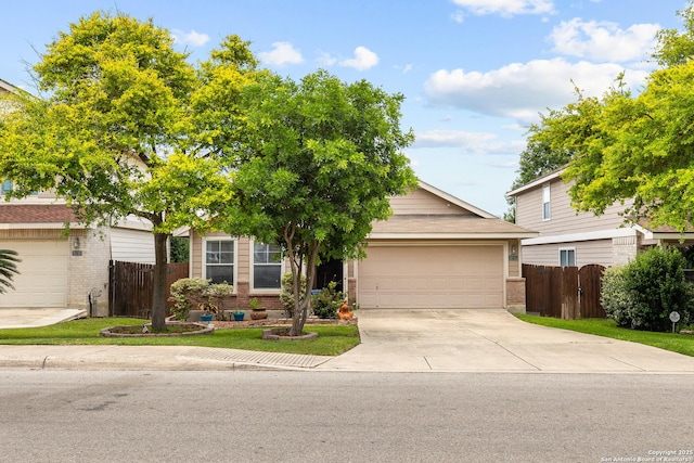 9235 Everton, San Antonio, TX 78245 - obstructed view of property with brick siding, driveway, and a garage