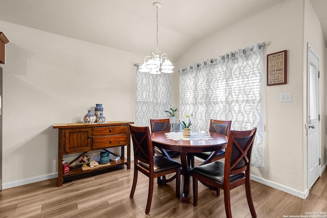 9235 Everton, San Antonio, TX 78245 - dining area with a chandelier, light wood finished floors, and lofted ceiling