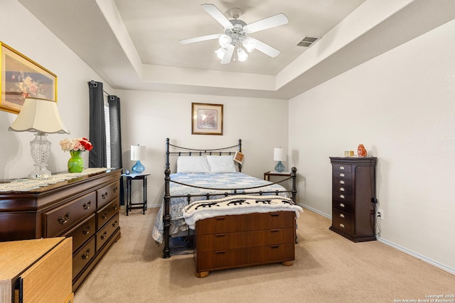 9235 Everton, San Antonio, TX 78245 - bedroom featuring light colored carpet, a raised ceiling, and a ceiling fan