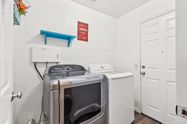 9235 Everton, San Antonio, TX 78245 - washroom featuring washer and dryer and dark wood-style floors