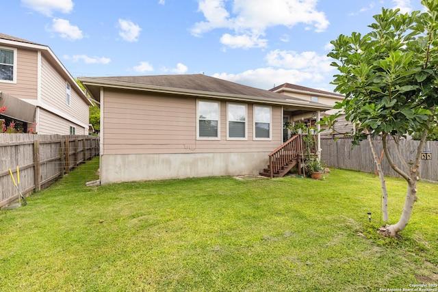 9235 Everton, San Antonio, TX 78245 - back of house with a fenced backyard and stairway