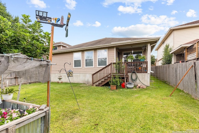 9235 Everton, San Antonio, TX 78245 - rear view of house featuring a fenced backyard and stairway