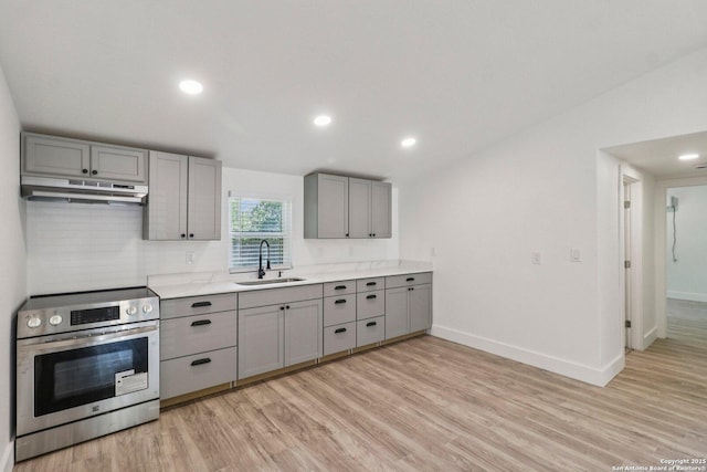 937 Anderson, Seguin, TX 78155 - kitchen featuring gray cabinetry, electric stove, under cabinet range hood, light wood-type flooring, and recessed lighting