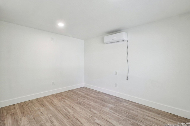 937 Anderson, Seguin, TX 78155 - unfurnished room with a wall mounted air conditioner, light wood-style flooring, and recessed lighting