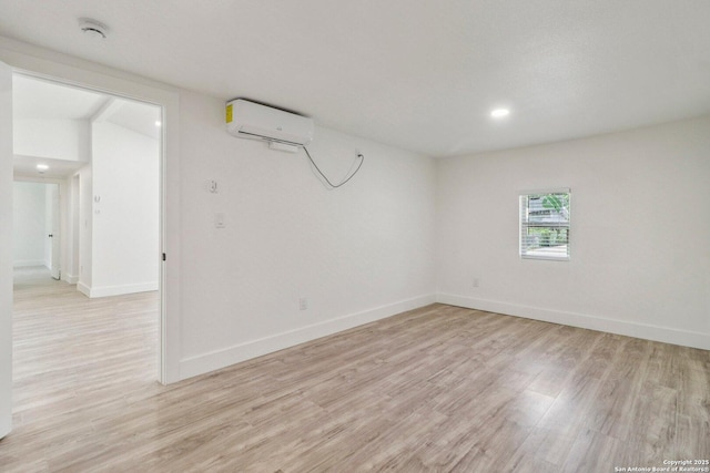 937 Anderson, Seguin, TX 78155 - unfurnished room with an AC wall unit, light wood-style floors, and recessed lighting