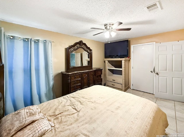 261 Shelburn, San Antonio, TX 78220 - bedroom with light tile patterned floors, a textured ceiling, and ceiling fan