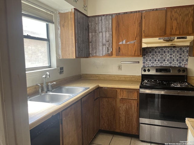 5212 Vinecrest, Kirby, TX 78219 - kitchen featuring stainless steel electric range oven, under cabinet range hood, dishwasher, light countertops, and light tile patterned flooring