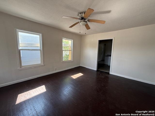 207 Fargo, San Antonio, TX 78220 - unfurnished room featuring wood finished floors, ceiling fan, and a textured ceiling
