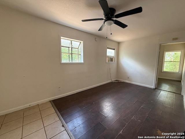 207 Fargo, San Antonio, TX 78220 - empty room with a ceiling fan, wood finished floors, and cooling unit